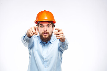 Engineers shirt orange hard hat construction lifestyle emotions cropped view light background