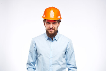 Engineer in orange coloring construction professional safety industry light background