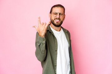 Young man with long hair look showing rock gesture with fingers