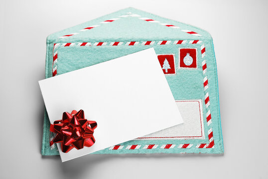 Christmas blank gift card over fabric embroidered envelope