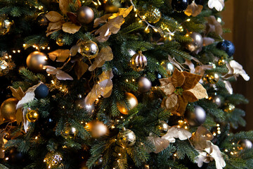 Christmas winter bokeh background. Christmas tree with festive balls. Festive holiday background with shallow depth of field and space for text. New Year winter horizontal design.