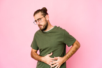 Young man with long hair look having a liver pain, stomach ache.