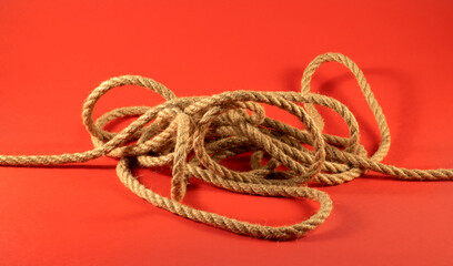 image of a sea rope on a red background close-up