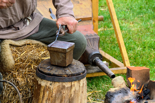 Work On A Roman Battlefield Forge On Occasion Of A Reenactment Festival At Carnuntum, Austria