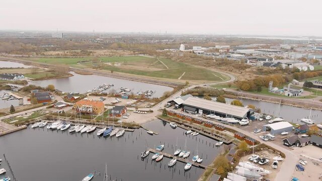 Aerial footage of Brondby Havn harbour in Copenhagen on a cloudy day 1080p 3
