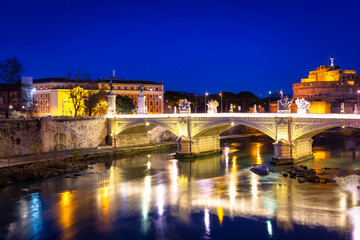 Obraz premium Saint Angel Castle over the Tiber river in Rome at night, Italy