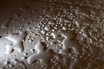 Water drops on a floor, macro - 396643849