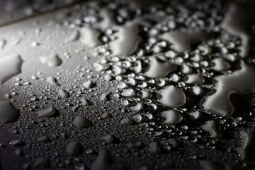 Water drops on a floor, macro - 396643861