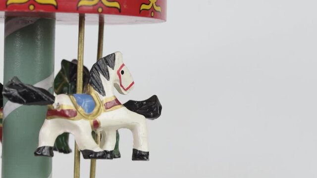 colorful carousel toy in white background close up