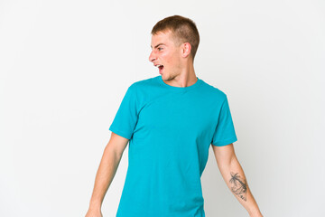 Fototapeta premium Young caucasian handsome man shouting very angry, rage concept, frustrated.