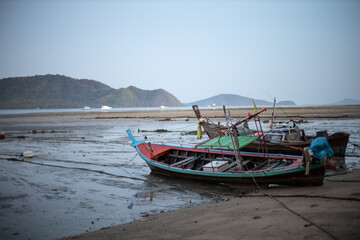 Thai fisherman boat parked at the coast - 396646230