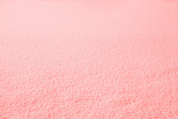 Background with natural snow toned in pink color