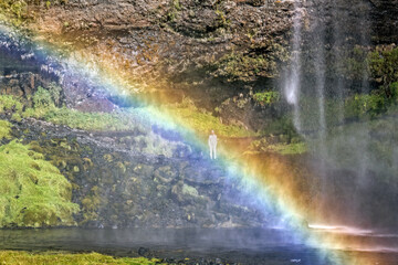 Fototapeta na wymiar Rainbow by Iceland waterfall
