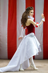 Attractive young girl dressed as red queen medievel costume