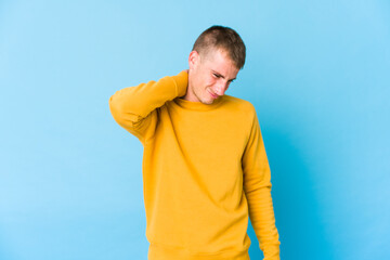 Fototapeta premium Young caucasian handsome man suffering neck pain due to sedentary lifestyle.