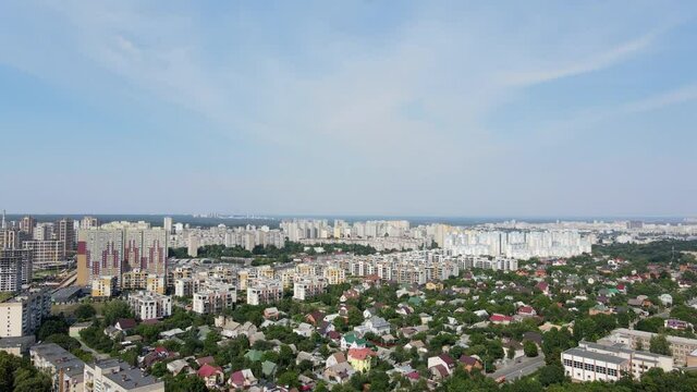 Aerial view above green city with residential houses. Shot in 4K. Ukraine