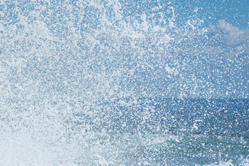 Splashing water drops, white waves, blue and white colours, snow effect. Abstract background, wallpaper and copy space. Gold Coast Queensland Australia