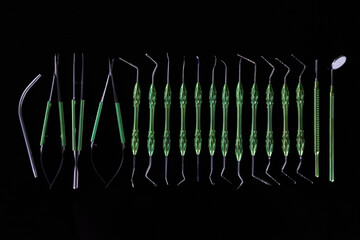 composition with dental instruments on a black background