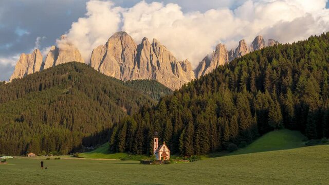 4k time lapse video of sunset at St. Johns church in South Tyrol, the Italian Dolomites with the Sass Rigais mountains 