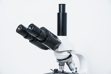 Biological microscope on a white background. Scientific concept, biology. Conducting biological research, checking tissues.
