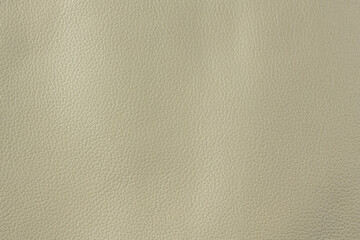 Beige textured smooth leather surface background, medium grain
