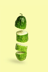 cucumber cut into pieces on a yellow background