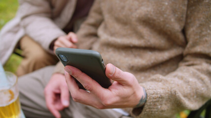 Close-up of a man and a woman talking via video link using their smartphone