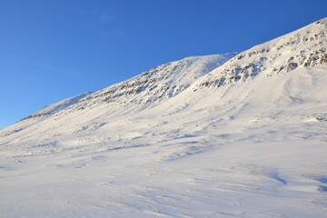 Walk through the frozen landscape during sunset. Iceland, Troll Peninsula