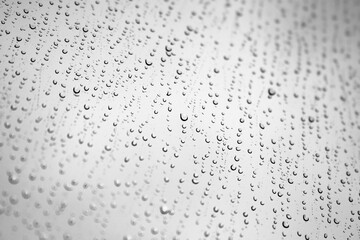 Water drops are on a window glass, background photo