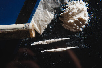 Hard drugs on black table. Close up