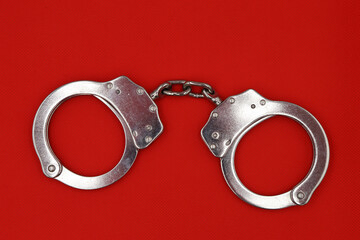 handcuffs on a red background