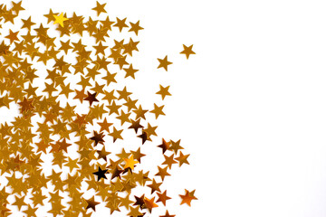 Festive background. Shining confetti stars on white background. Christmas. Wedding. Birthday. Happy woman's day. Mothers Day. Valentine's Day. Flat lay, top view, copy space.
