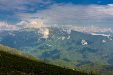 Fototapeta premium Beautiful mountain landscape at Caucasus mountains with clouds and blue sky