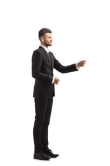 Full length profile shot of a businessman gesturing with hand