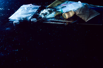 Obraz premium Purchase, possession and sale of drugs is punishable by law. Many types of narcotics and drugs represented on table.