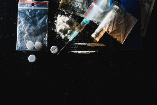 Hard drugs on dark table © Serhii