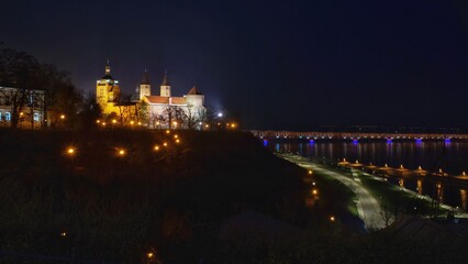 night view of the Tumskie hill and the bridge in Plock in Poland