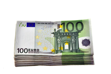 concept of wealth in euros: a pile of 10,000 euros in one hundred 100 euro banknotes isolated on...
