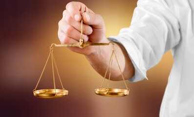 Weight scales in hand on blur background