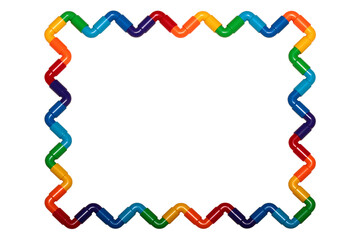 Rainbow colored plastic pipes, bending shapes isolated against white background