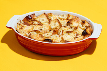 Close up of banana bread pudding served in casserole