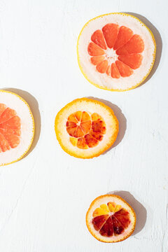Overhead view of citrus fruit slices on table