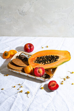High angle view of fruits, crackers and chocolate bars served on tray