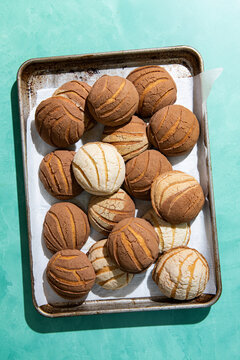 Overhead view of conchas in baking tray
