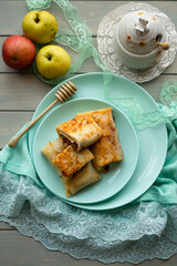 Pancake rolls with apple and honey, belarusian dish