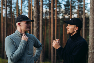 View of men talking with each other in forest