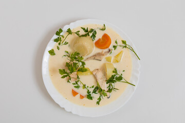 Salmon fish soup. Culinary background with selective focus