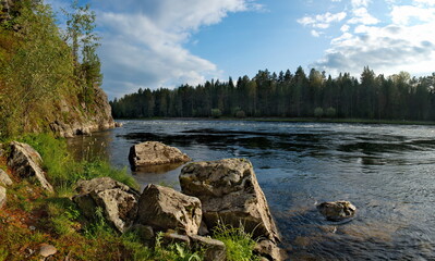 Fototapeta na wymiar Russia. mountain Altai. Stony Bank of the Biya river near the source of lake Teletskoye.