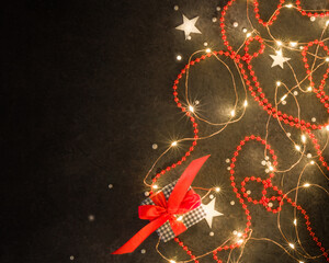 Christmas background for postcards. LED garland on a dark background.