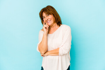 Senior caucasian woman isolated smiling happy and confident, touching chin with hand.
